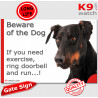 black and tan Dobermann, funny Portal Sign "Beware of the Dog, need exercise, ring & run" gate photo hilarious plate notice